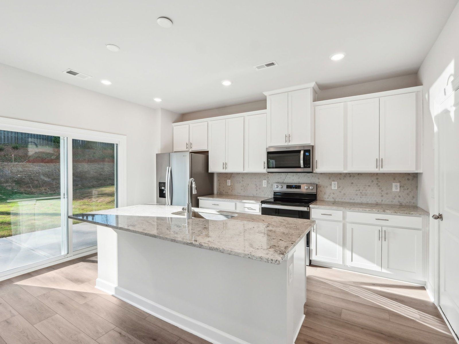 Cook your favorite meals in the sleek, modern kitchen.