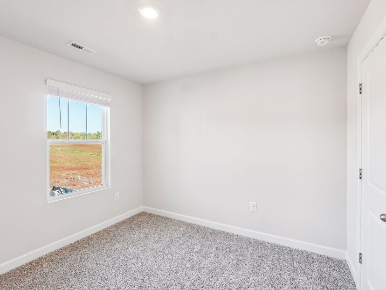 The secondary bedroom is the perfect spot for guests and visitors.
