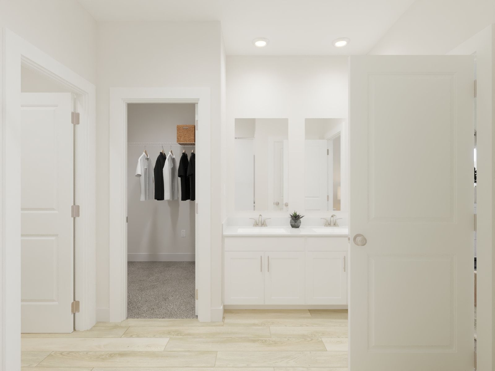 The primary bathroom offers dual vanity sinks and a walk-in shower.