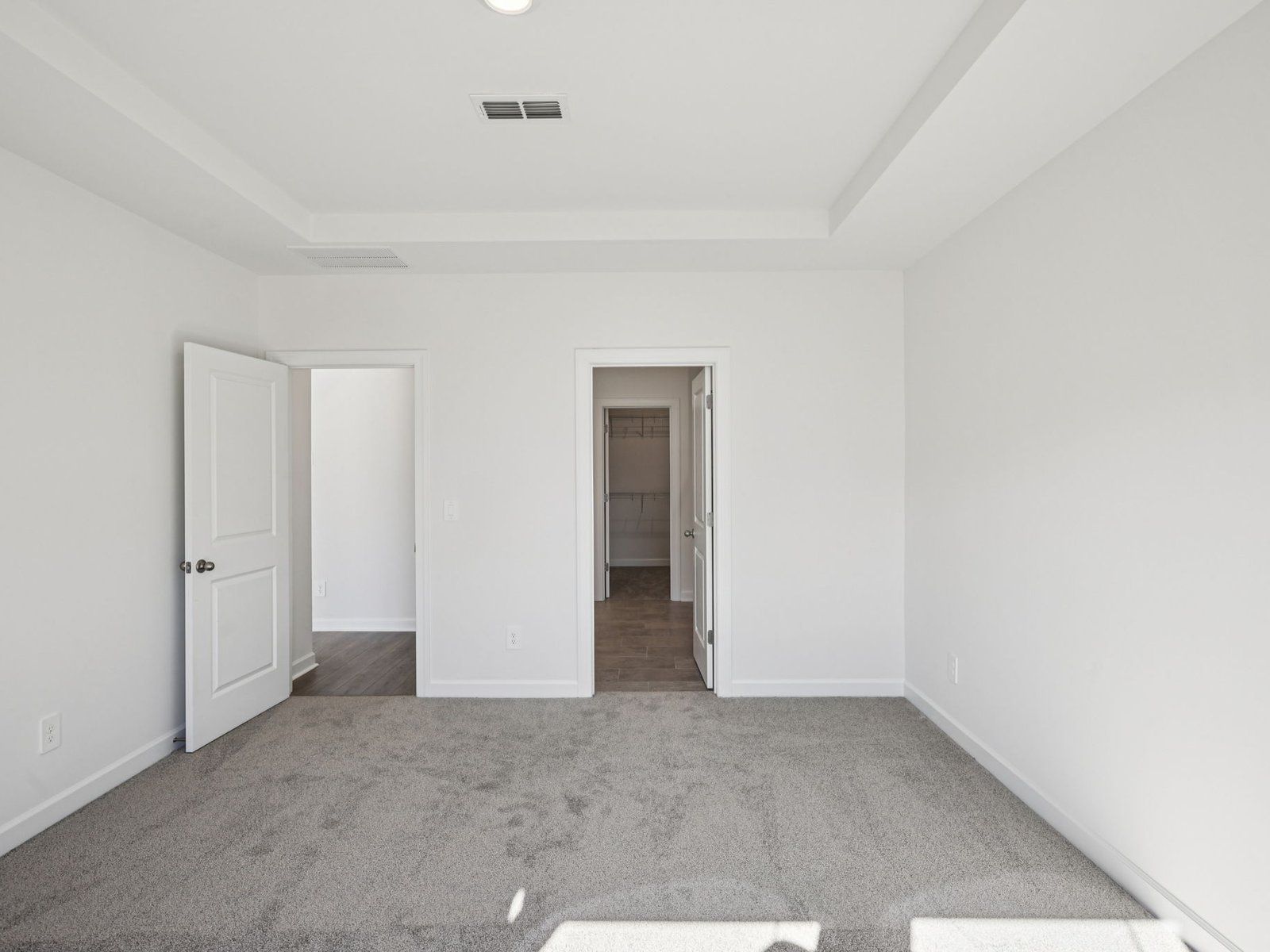 The primary bedroom connects to your own personal ensuite.