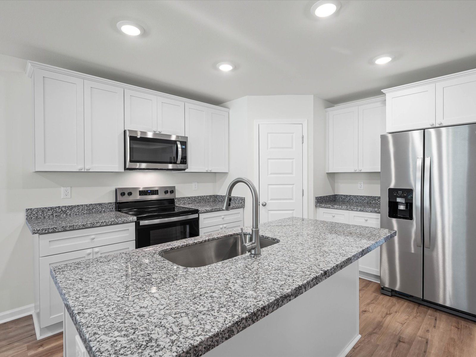 Kitchen in the Opal floorplan at a Meritage Homes community in Ocean Springs, MS.