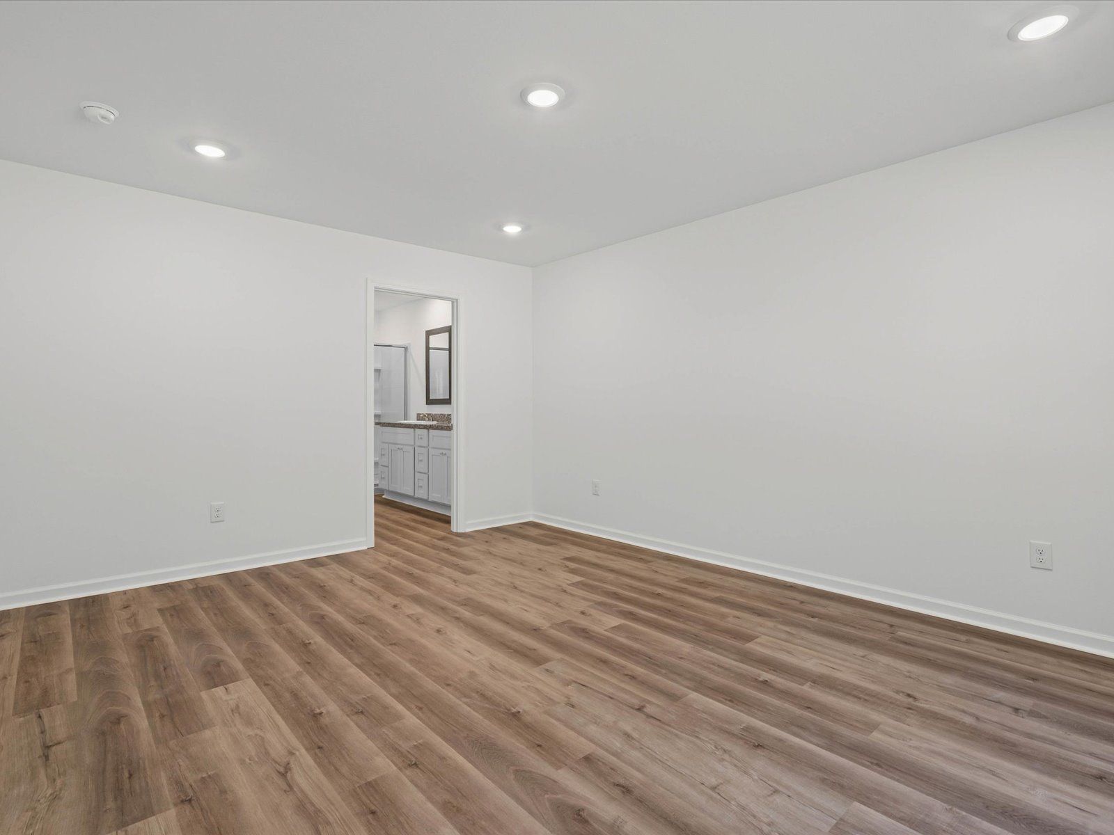 Primary bedroom in the Opal floorplan at a Meritage Homes community in Ocean Springs, MS.
