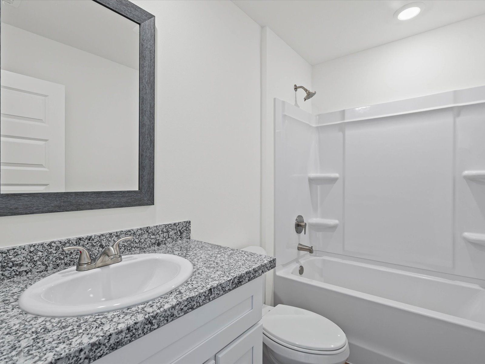 Secondary bathroom in the Opal floorplan at a Meritage Homes community in Ocean Springs, MS.