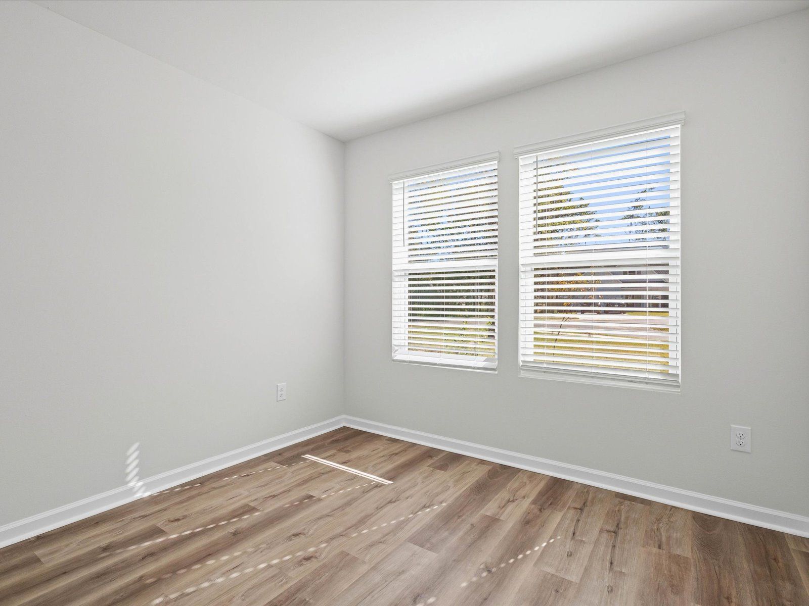 Secondary bedroom in the Opal floorplan at a Meritage Homes community in Ocean Springs, MS.