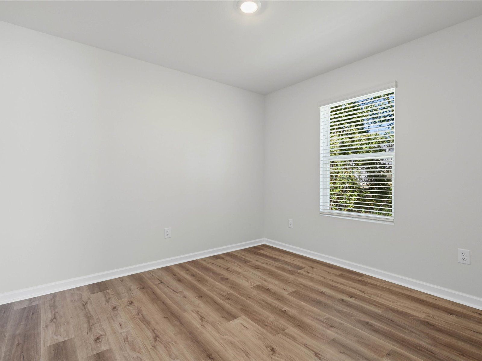 Secondary bedroom in the Opal floorplan at a Meritage Homes community in Ocean Springs, MS.