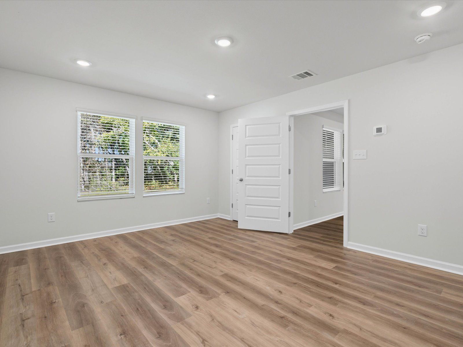Primary bedroom in the Opal floorplan at a Meritage Homes community in Ocean Springs, MS.