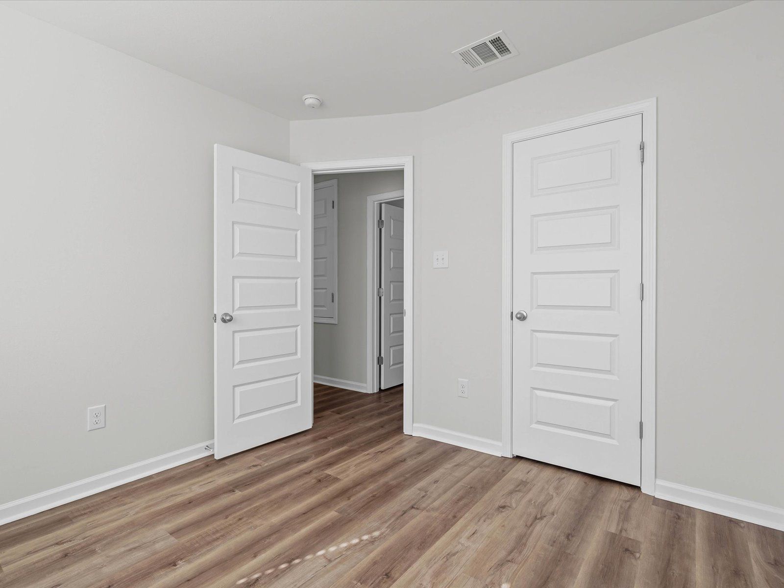 Secondary bedroom in the Opal floorplan at a Meritage Homes community in Ocean Springs, MS.