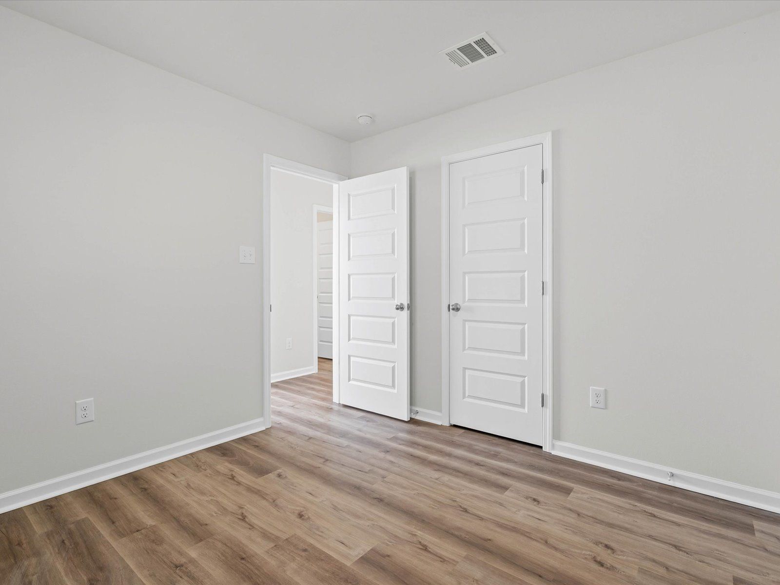 Secondary bedroom in the Opal floorplan at a Meritage Homes community in Ocean Springs, MS.