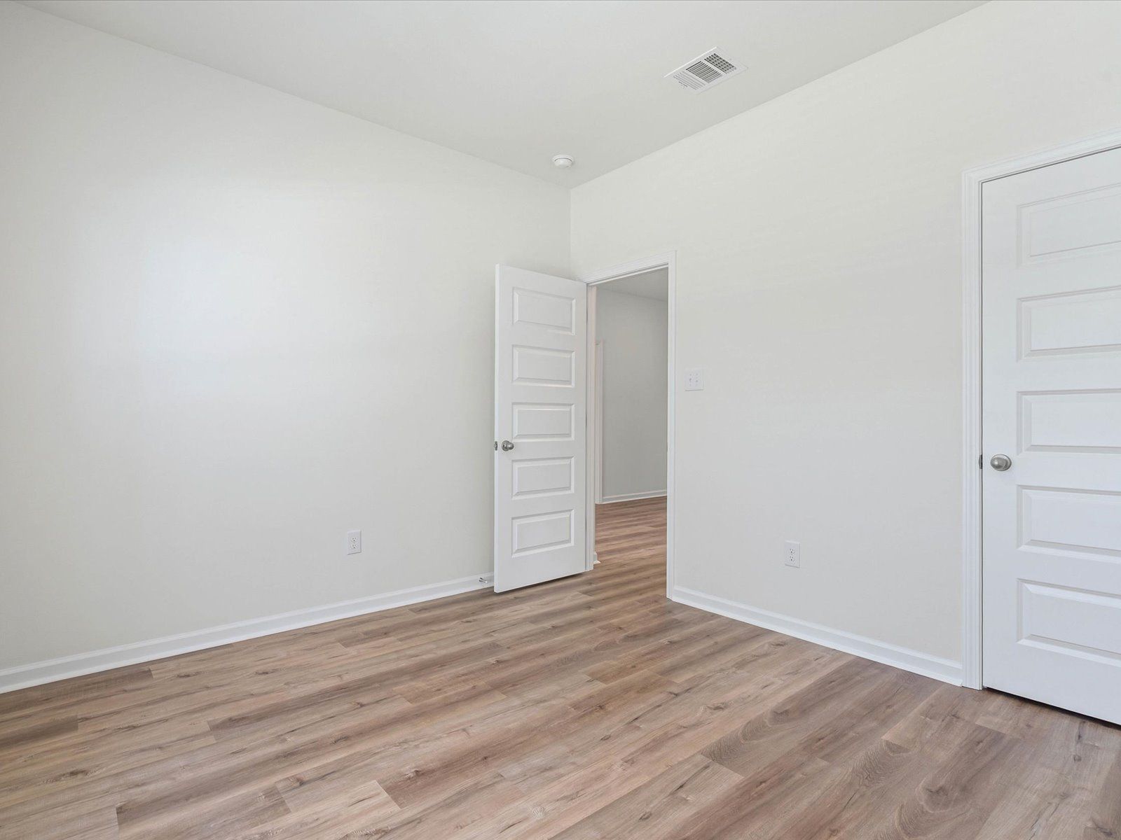 Secondary bedroom in the Dune floorplan at a Meritage Homes community in Ocean Springs, MS.