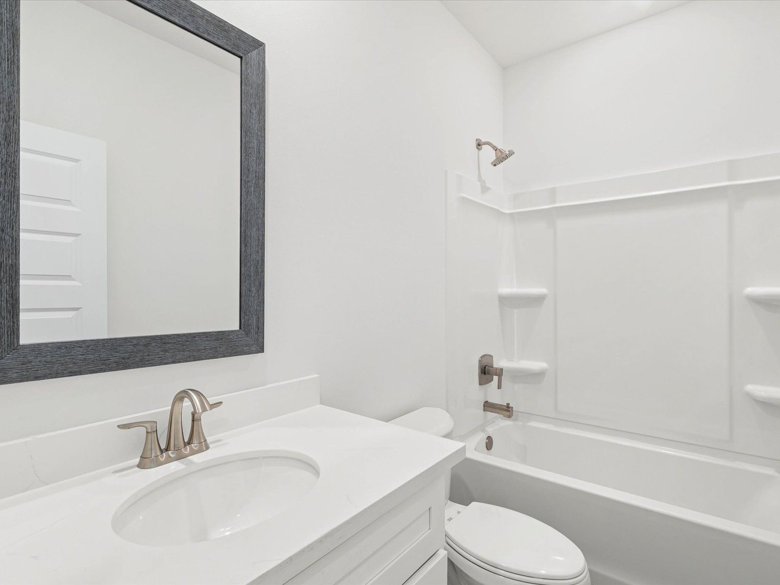 Secondary bathroom in the Dune floorplan at a Meritage Homes community in Ocean Springs, MS.