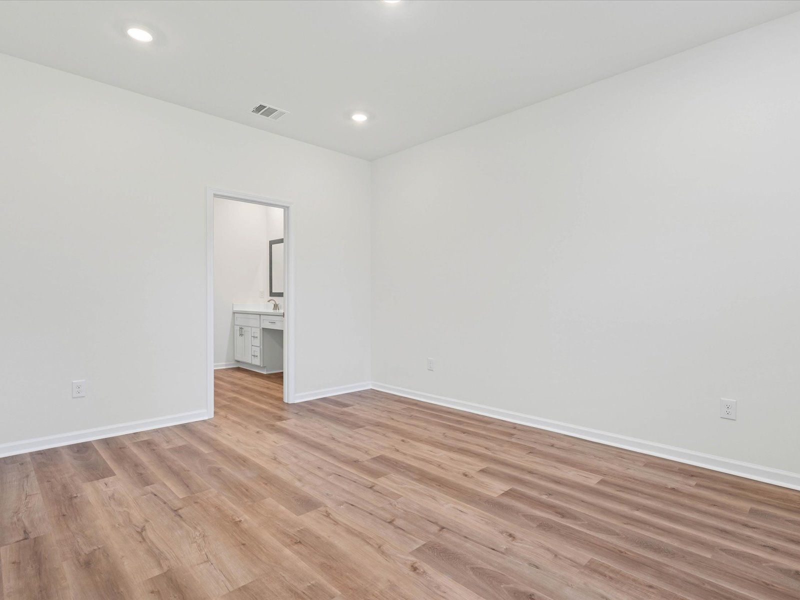 Primary bedroom in the Dune floorplan at a Meritage Homes community in Ocean Springs, MS.