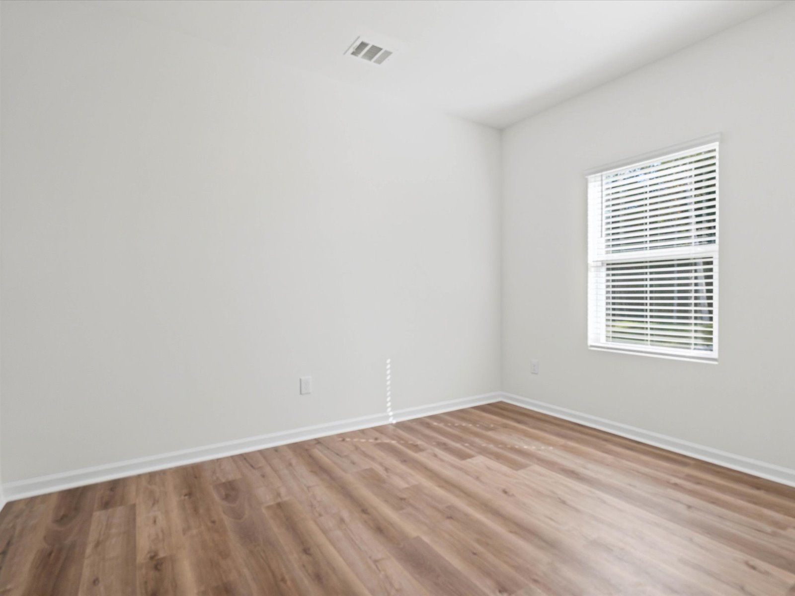 Secondary bedroom in the Dune floorplan at a Meritage Homes community in Ocean Springs, MS.