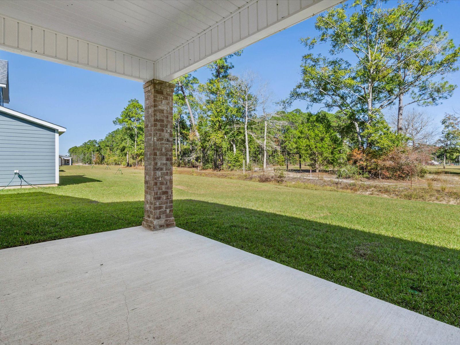 Covered patio in the Dune floorplan at a Meritage Homes community in Ocean Springs, MS.