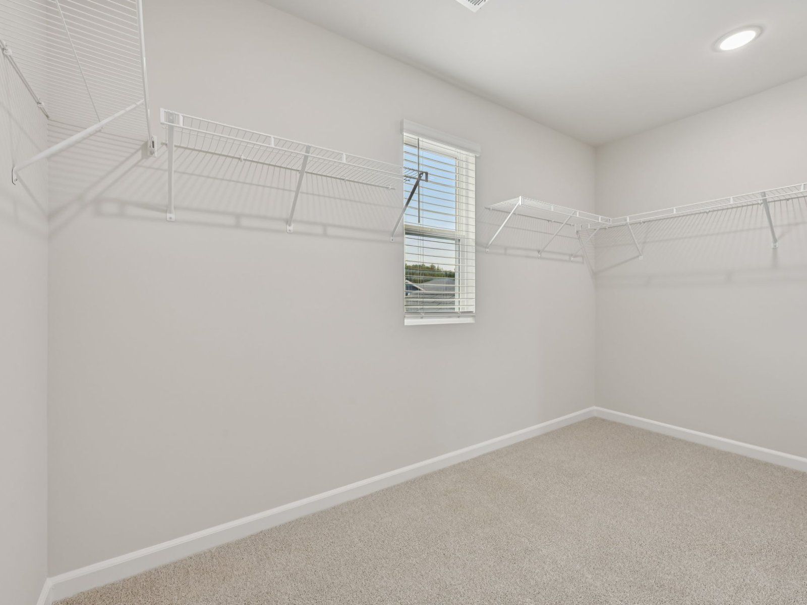 Walk-in closet in the Dakota floorplan at a Meritage Homes community in Garner, NC.