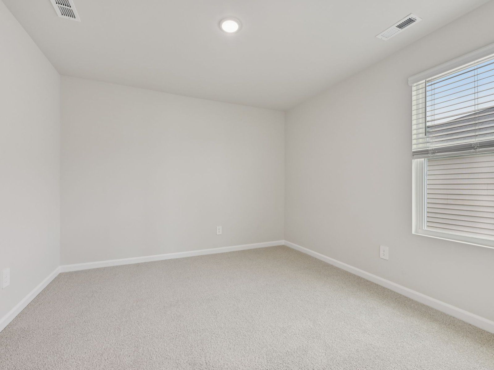 Secondary bedroom in the Dakota floorplan at a Meritage Homes community in Garner, NC.