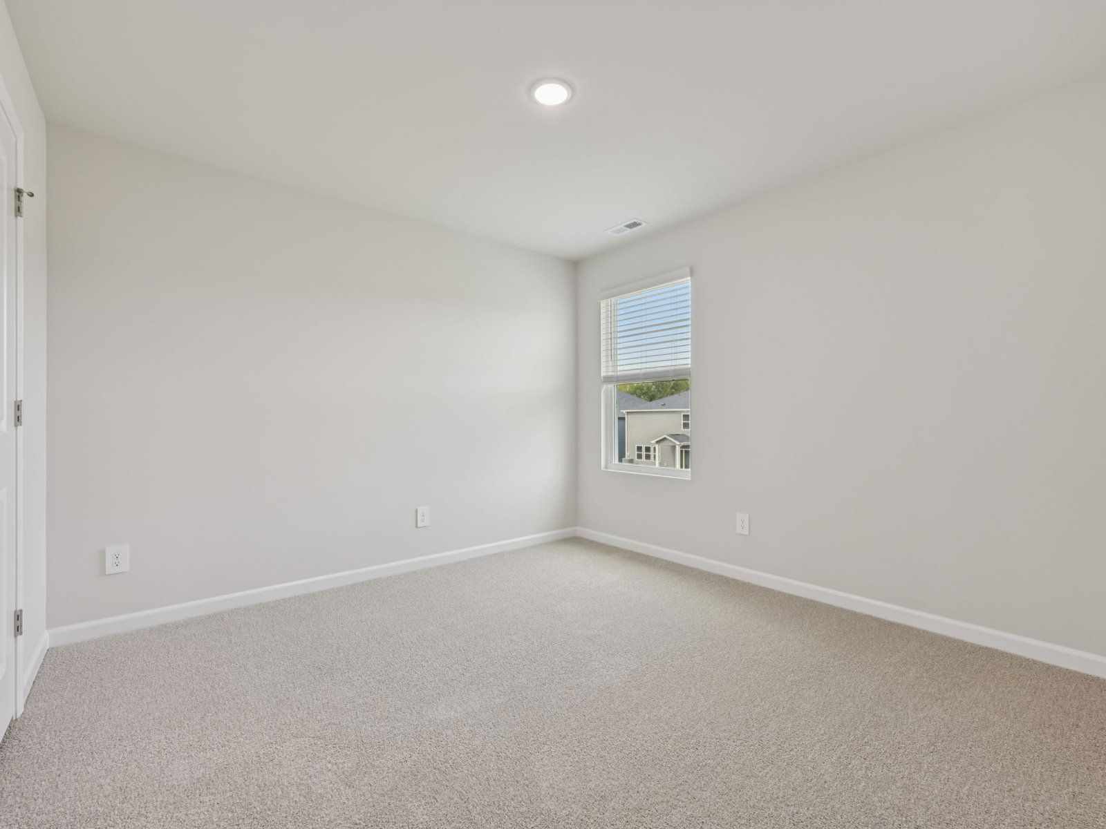 Secondary bedroom in the Dakota floorplan at a Meritage Homes community in Garner, NC.