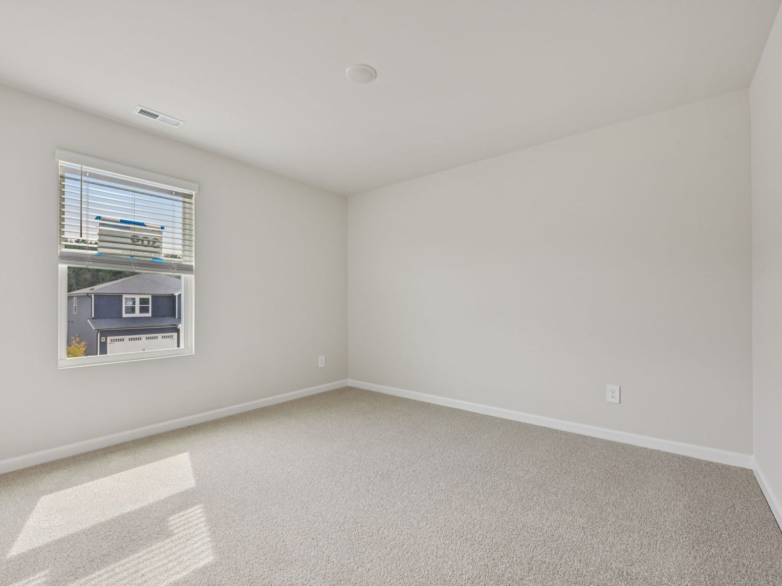 Secondary bedroom in the Dakota floorplan at a Meritage Homes community in Garner, NC.