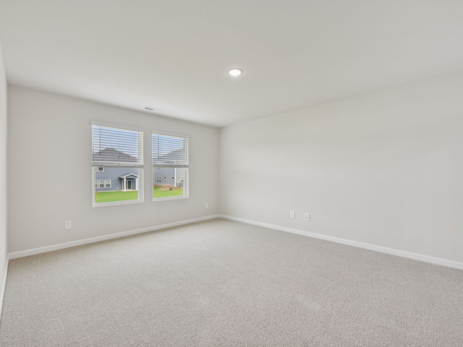 Primary bedroom in the Dakota floorplan at a Meritage Homes community in Garner, NC.