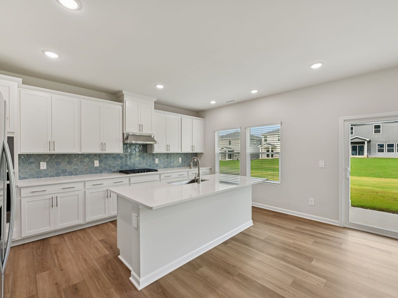 Kitchen in the Dakota floorplan at a Meritage Homes community in Garner, NC.