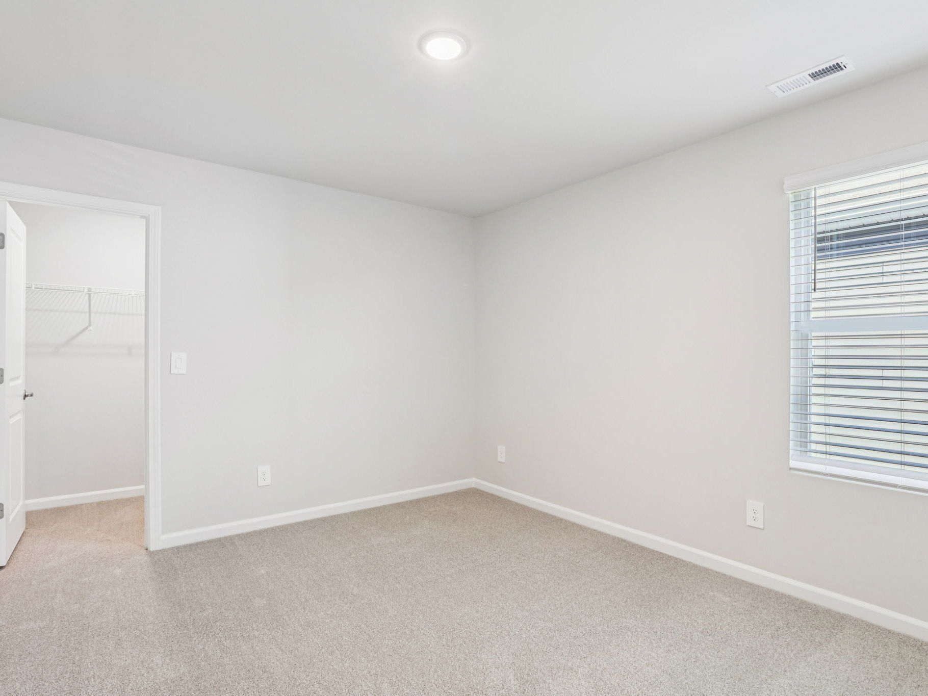 Secondary bedroom in the Johnson floorplan at a Meritage Homes community in Garner, NC.