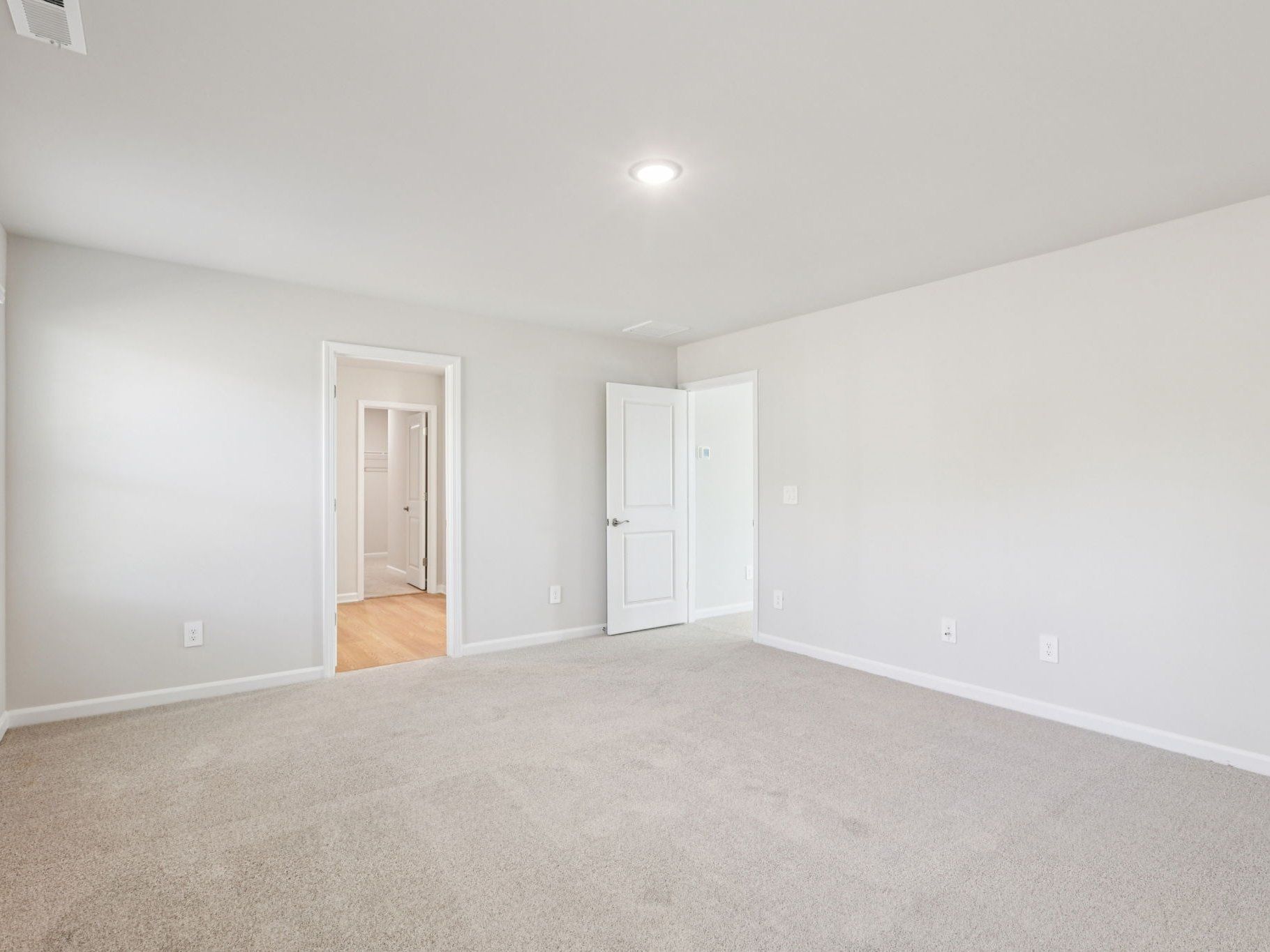 Primary bedroom in the Johnson floorplan at a Meritage Homes community in Garner, NC.
