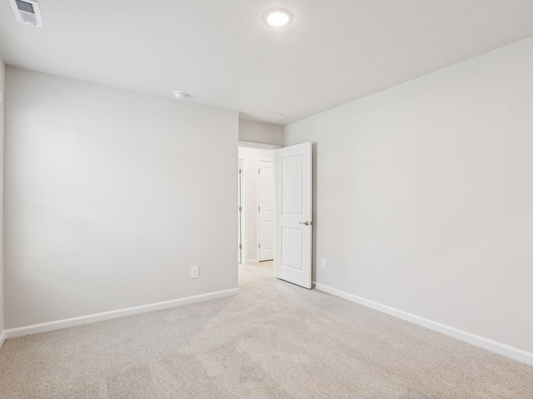 Secondary bedroom in the Johnson floorplan at a Meritage Homes community in Garner, NC.