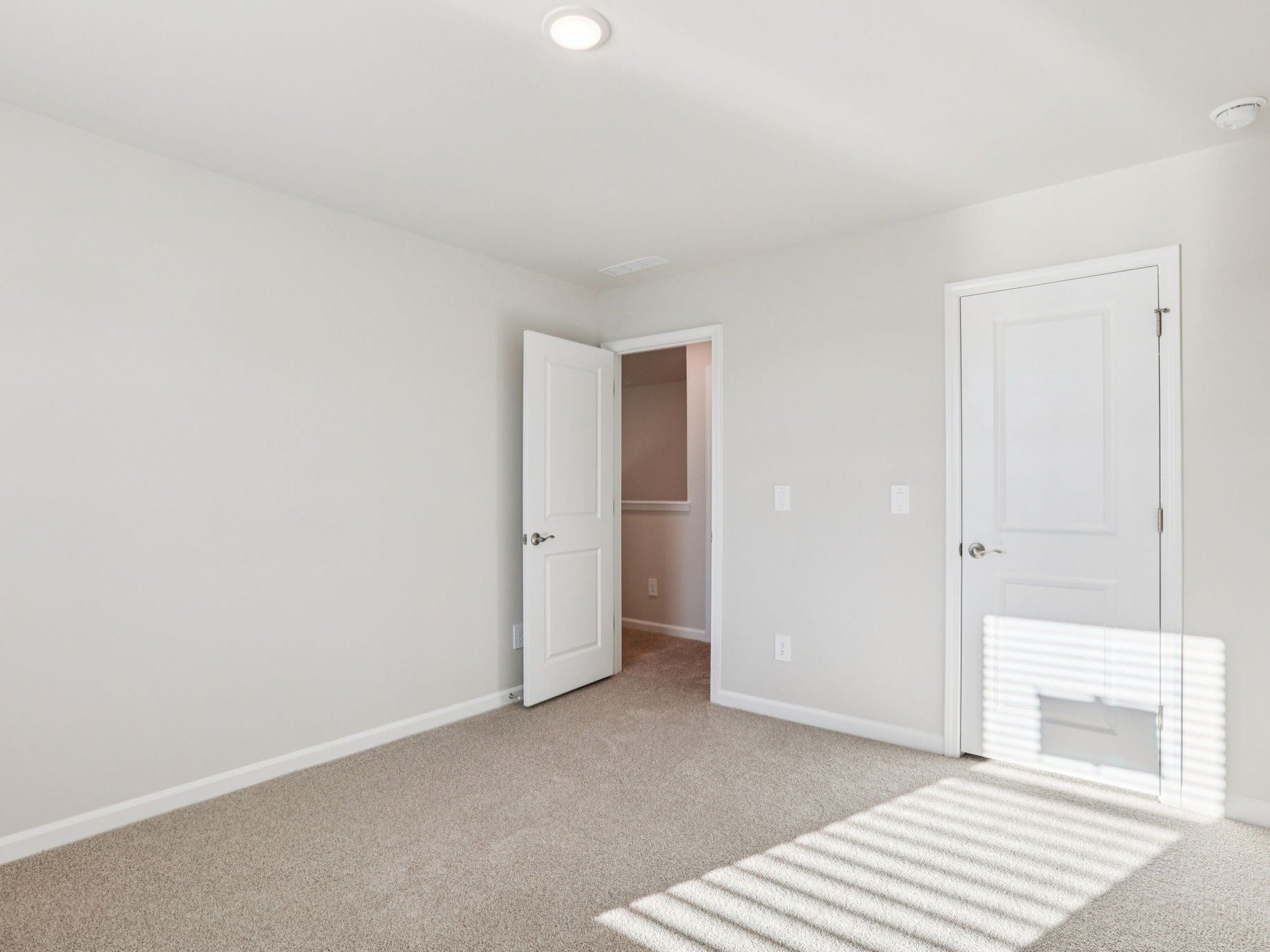 Secondary bedroom in the Johnson floorplan at a Meritage Homes community in Garner, NC.