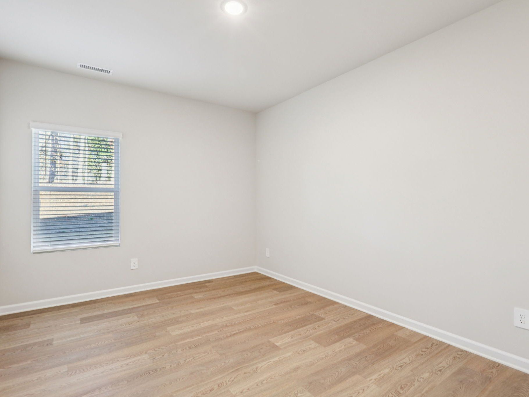 Secondary bedroom in the Johnson floorplan at a Meritage Homes community in Garner, NC.