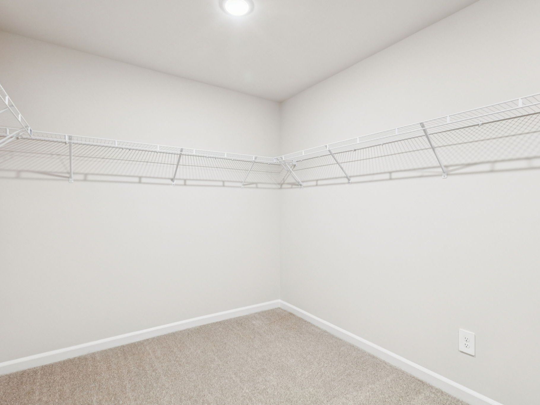Walk-in closet in the Johnson floorplan at a Meritage Homes community in Garner, NC.