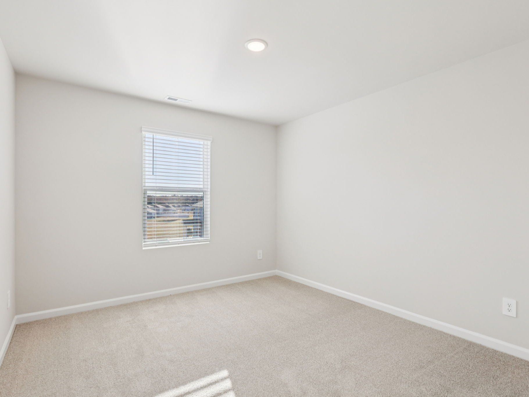 Secondary bedroom in the Johnson floorplan at a Meritage Homes community in Garner, NC.