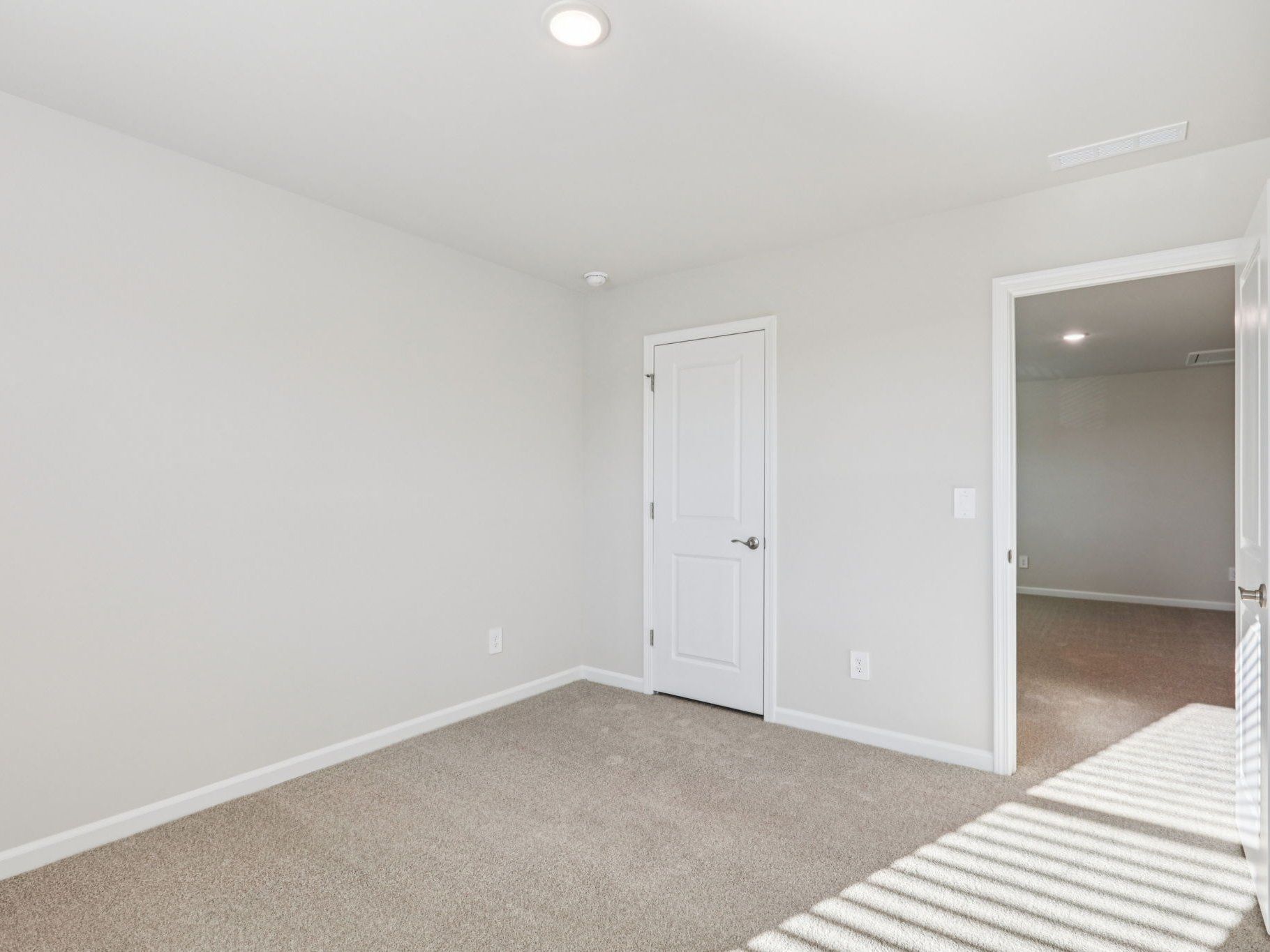 Secondary bedroom in the Johnson floorplan at a Meritage Homes community in Garner, NC.