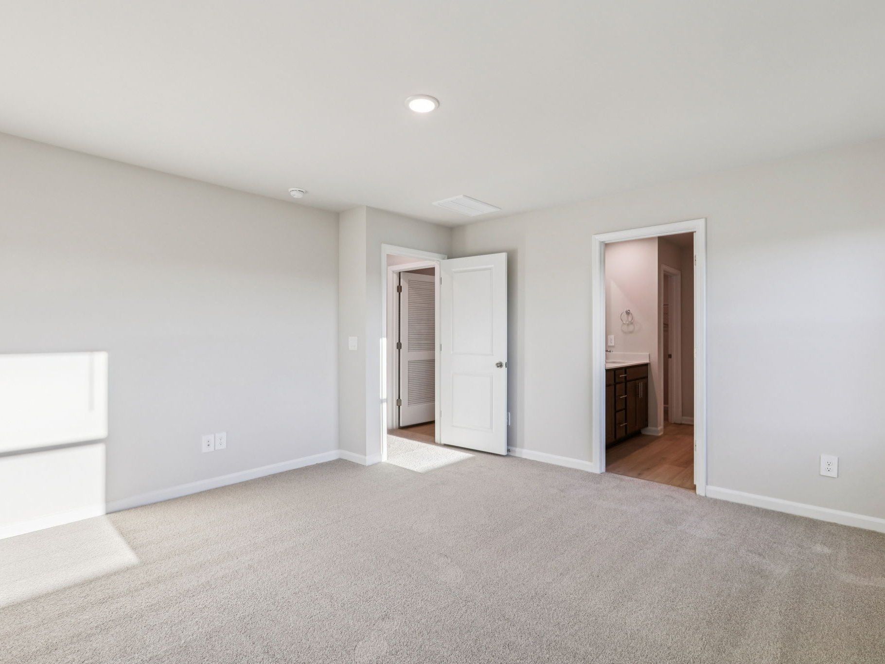 Primary bedroom in the Lennon floorplan at a Meritage Homes community in Garner, NC.