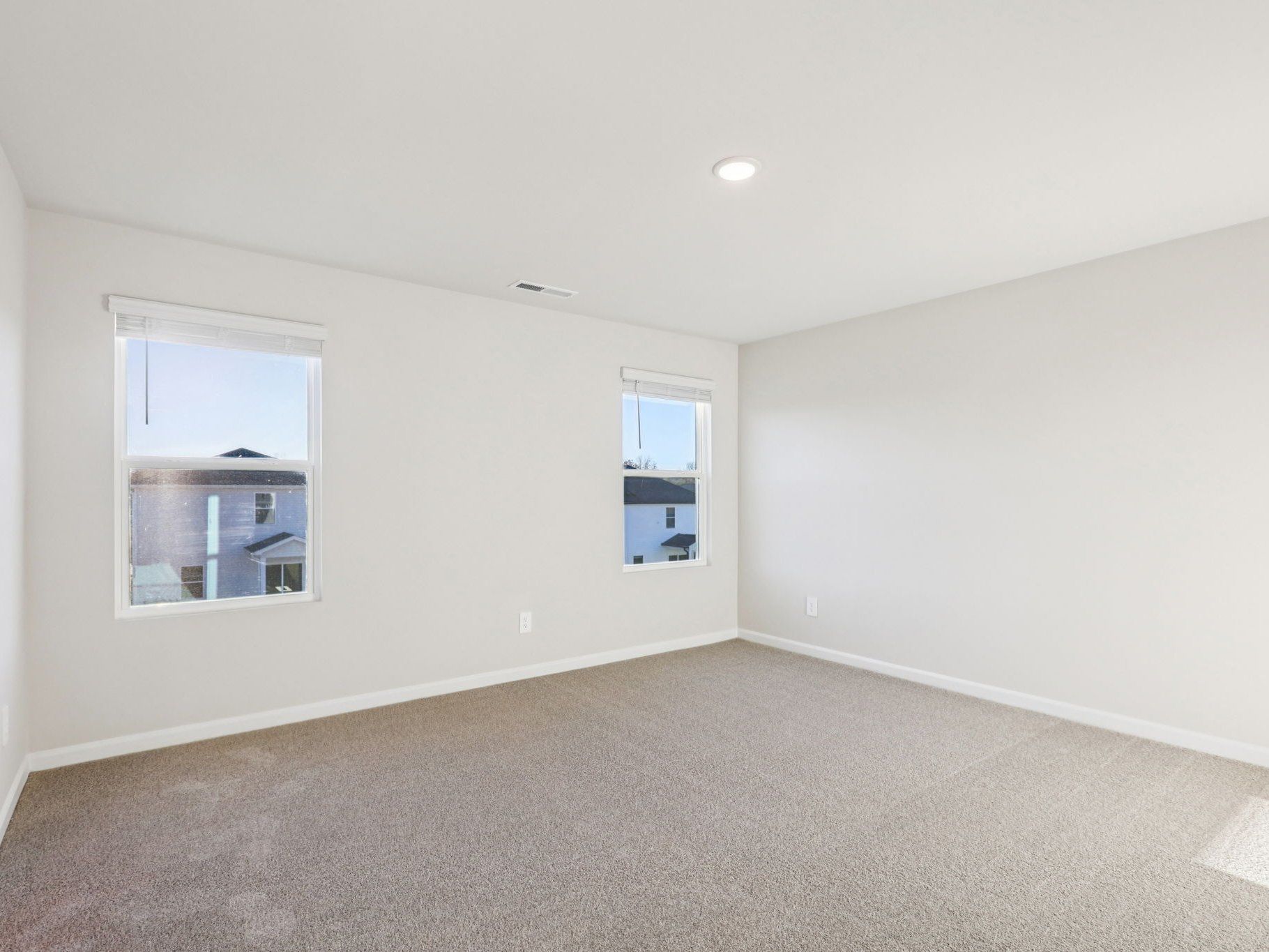 Primary bedroom in the Lennon floorplan at a Meritage Homes community in Garner, NC.