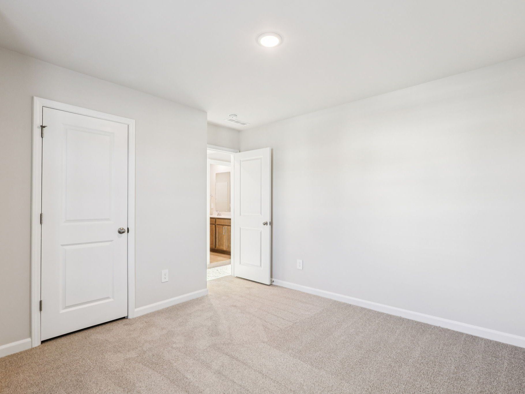 Secondary bedroom in the Lennon floorplan at a Meritage Homes community in Garner, NC.