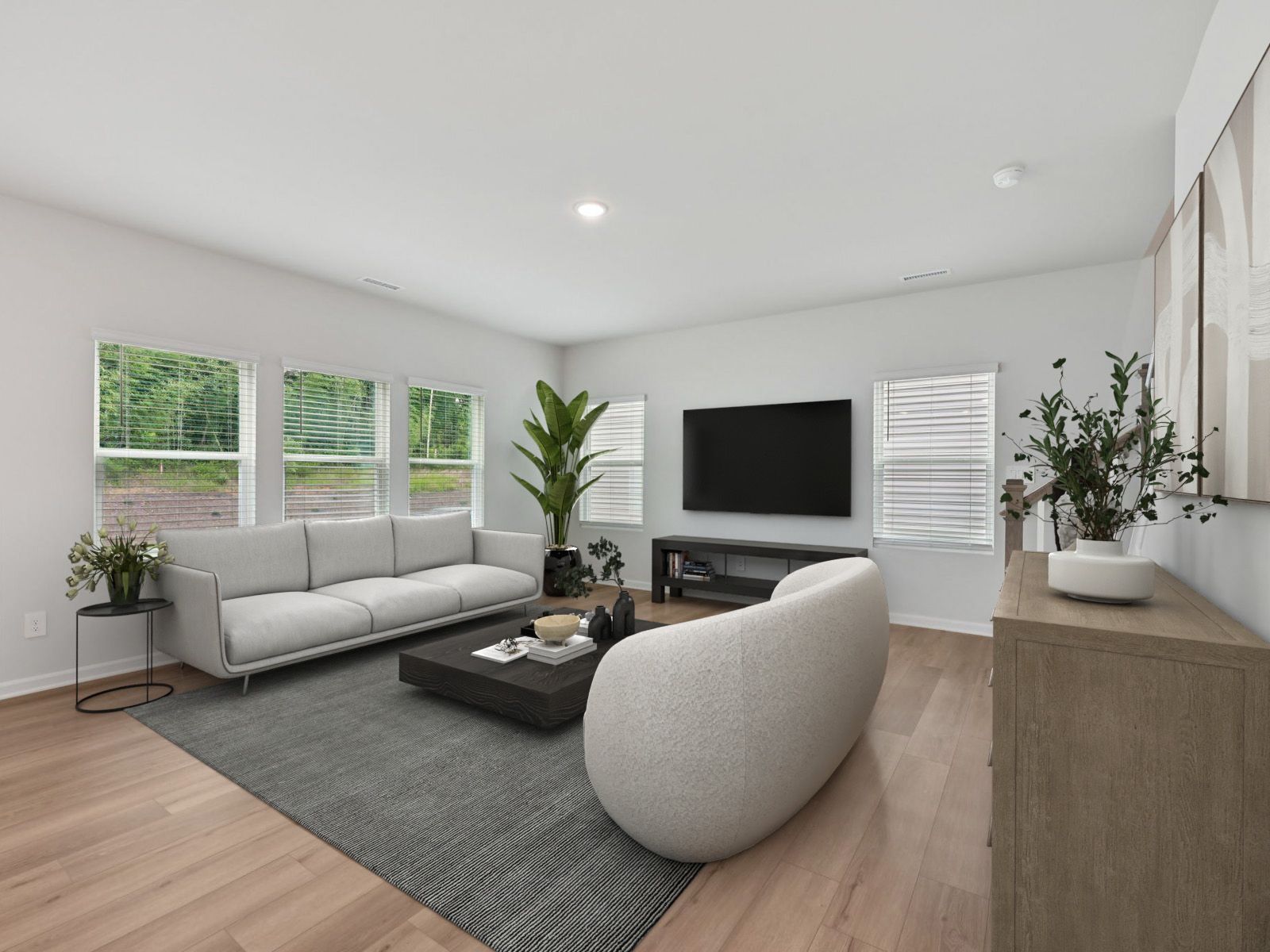 Great room in the Brentwood floorplan at a Meritage Homes community in Garner, NC.