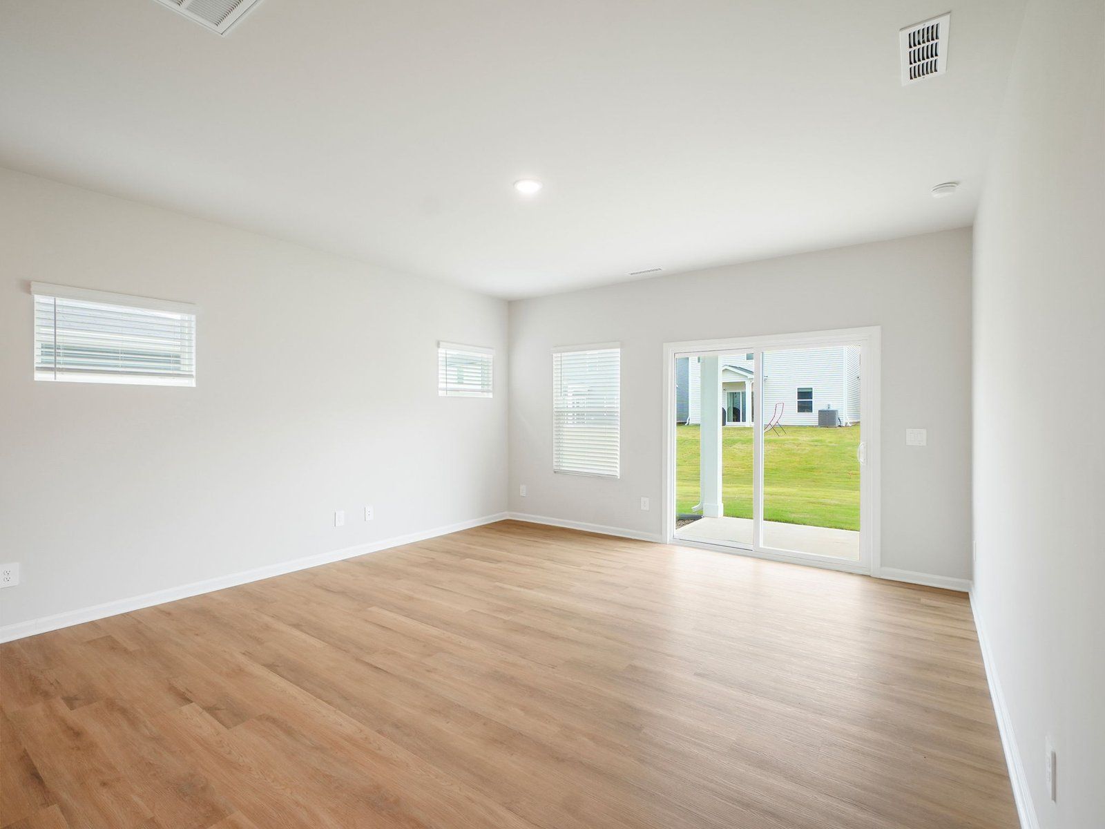 Great room in the Paisley floorplan at a Meritage Homes community in Garner, NC.