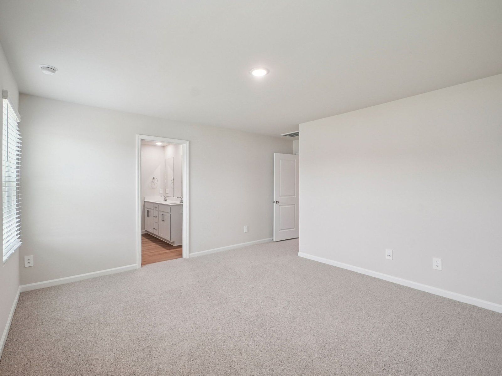 Primary bedroom in the Paisley floorplan at a Meritage Homes community in Garner, NC.