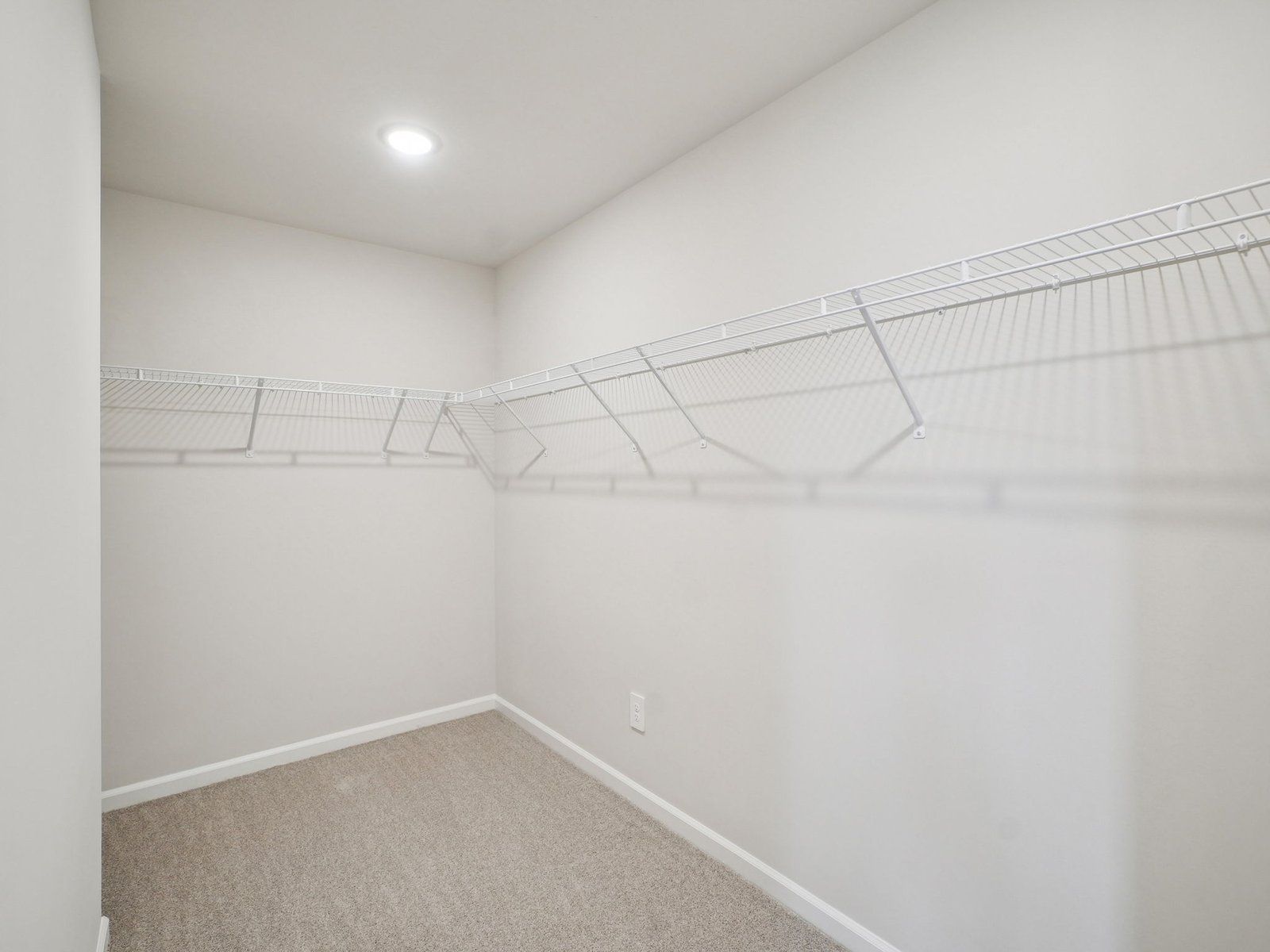 Walk-in closet in the Paisley floorplan at a Meritage Homes community in Garner, NC.
