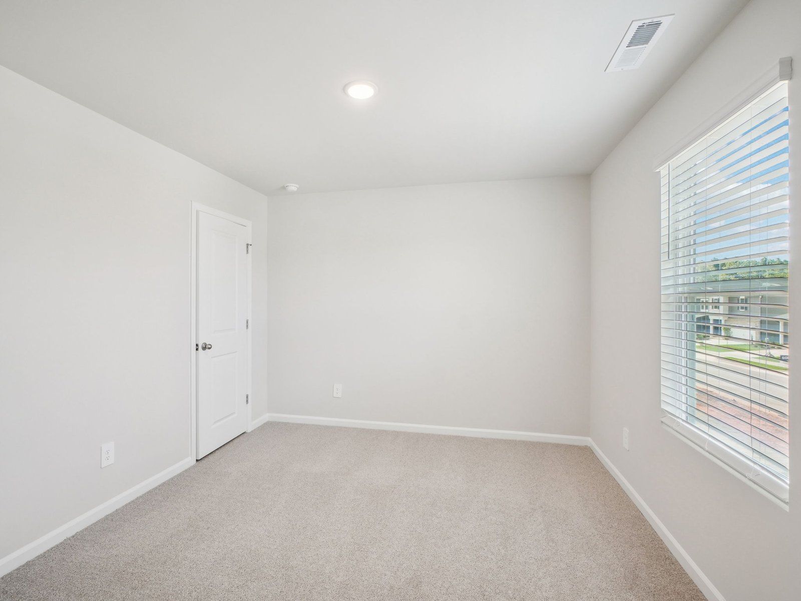 Secondary bedroom in the Paisley floorplan at a Meritage Homes community in Garner, NC.