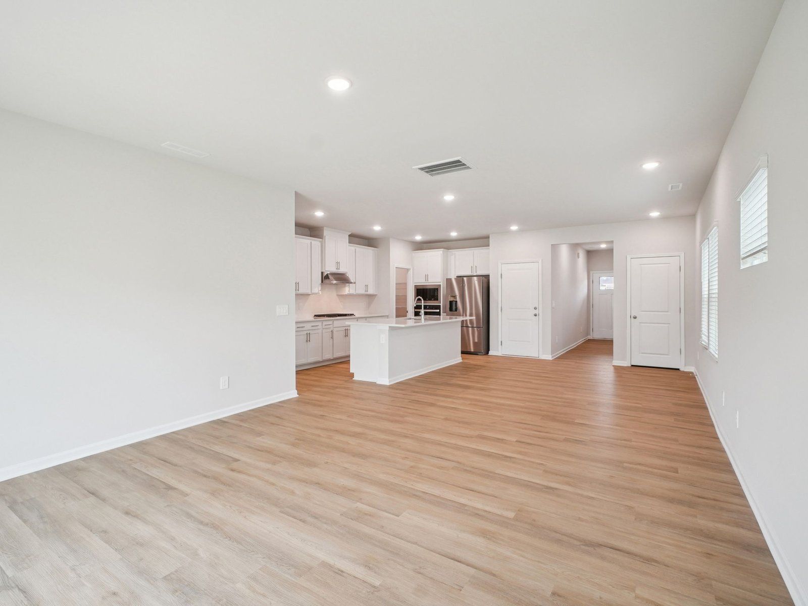 Great room in the Paisley floorplan at a Meritage Homes community in Garner, NC.