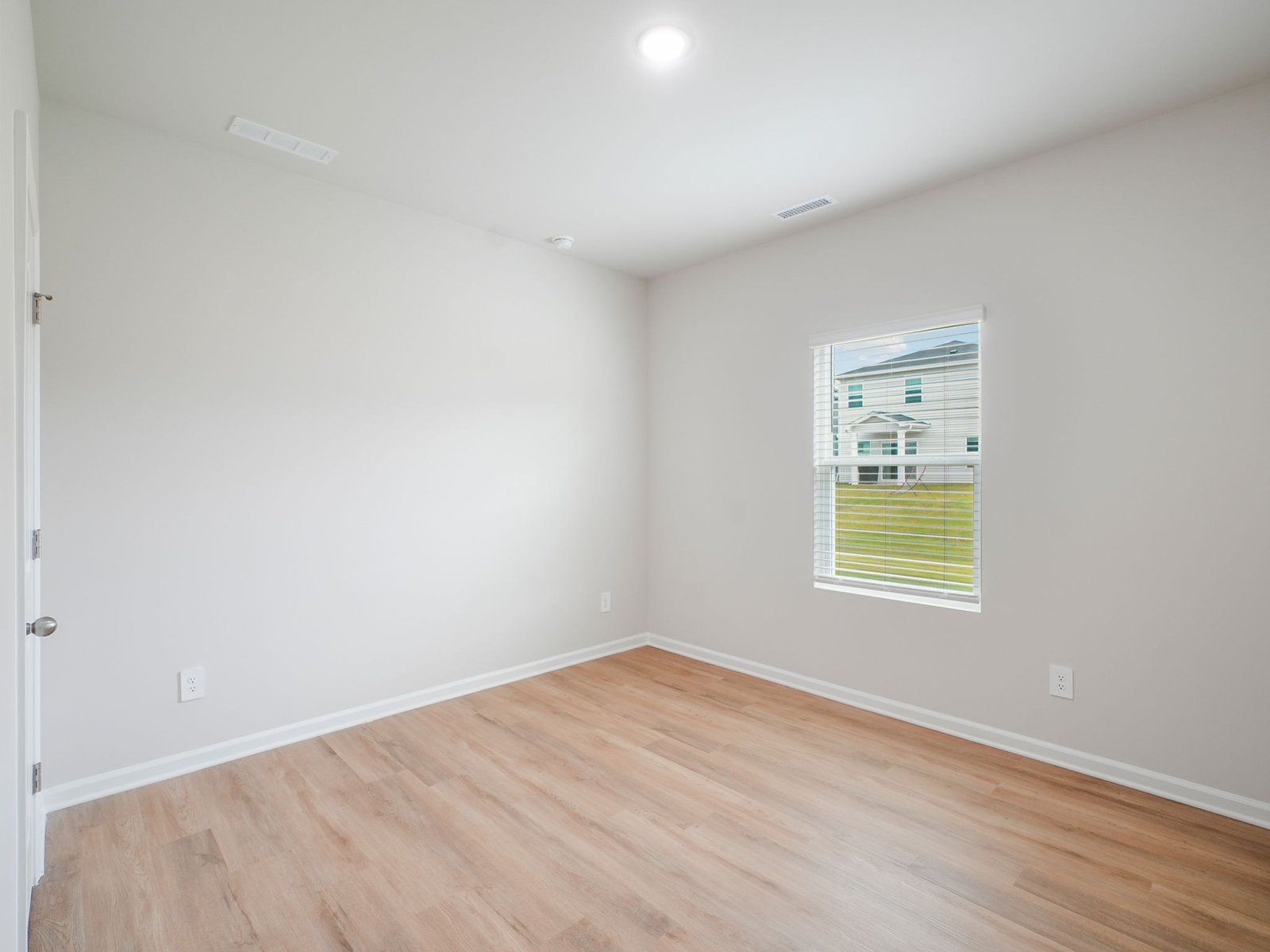 Secondary bedroom in the Paisley floorplan at a Meritage Homes community in Garner, NC.