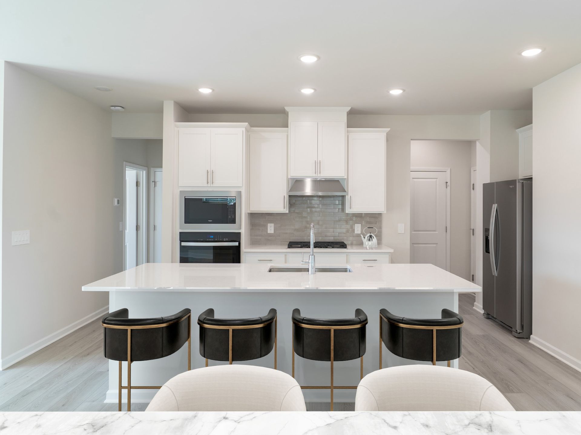 Kitchen in the Roswell floorplan at a Meritage Homes community in Garner, NC.