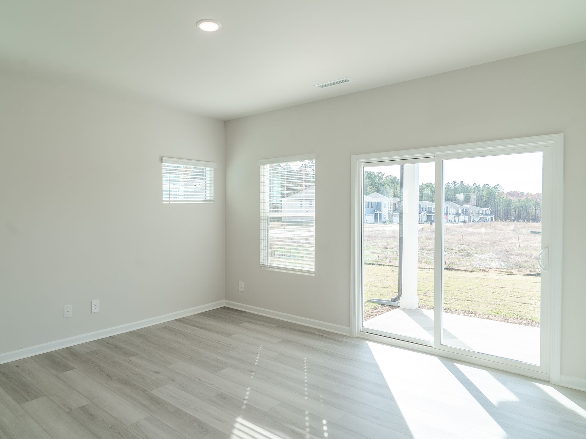 Great room in the Roswell floorplan at a Meritage Homes community in Garner, NC.