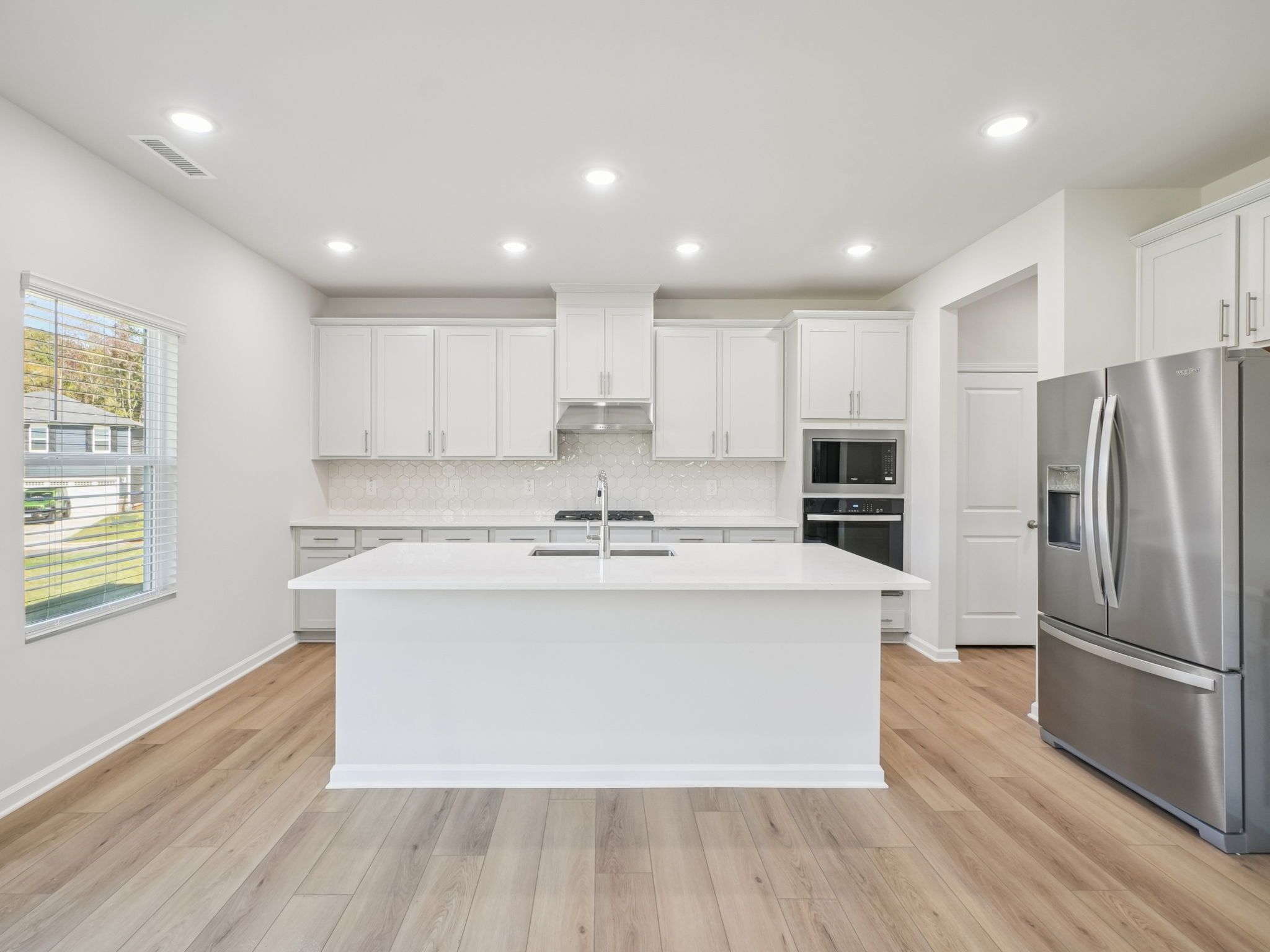 Kitchen in the Taylorsville floorplan at a Meritage Homes community in Garner, NC.