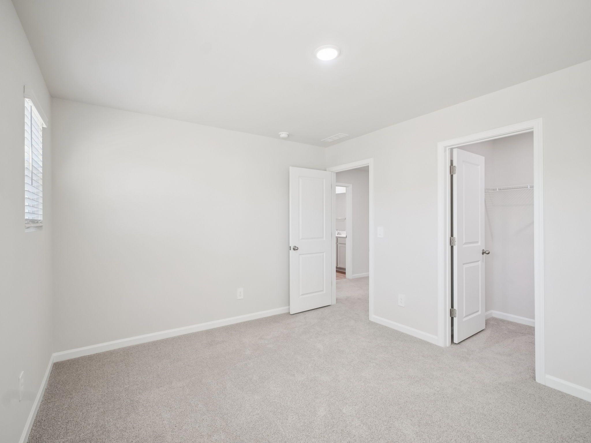 Secondary bedroom in the Taylorsville floorplan at a Meritage Homes community in Garner, NC.