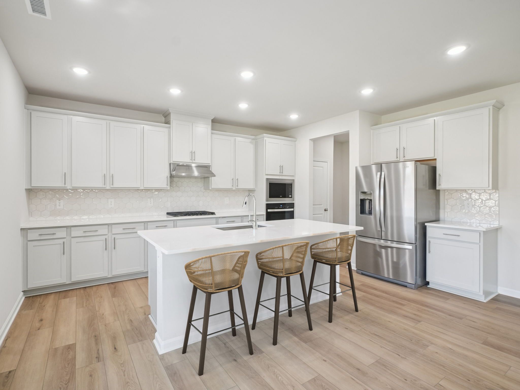 Kitchen in the Taylorsville floorplan at a Meritage Homes community in Garner, NC.