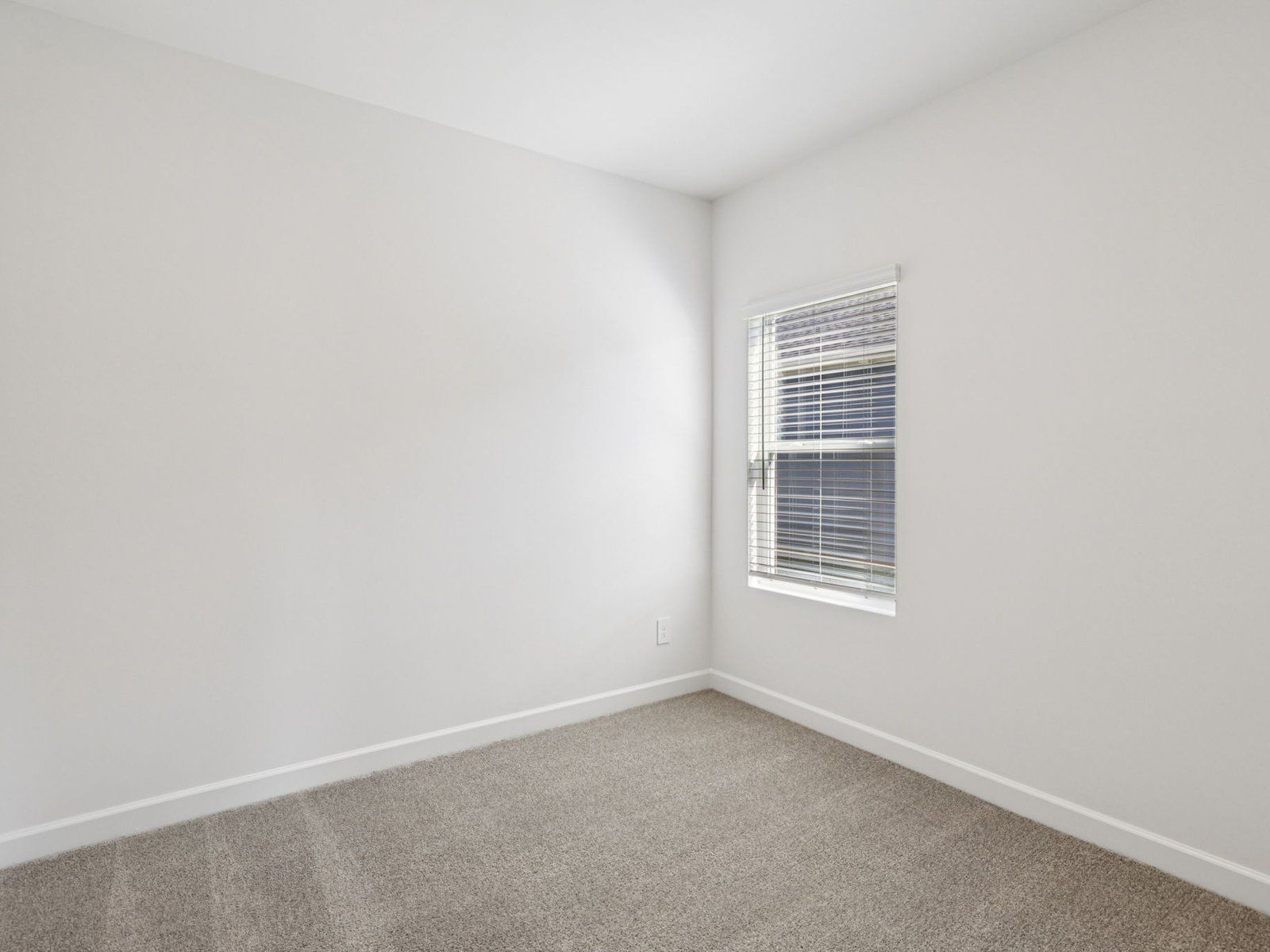 This secondary bedroom can be customized into the perfect home office.