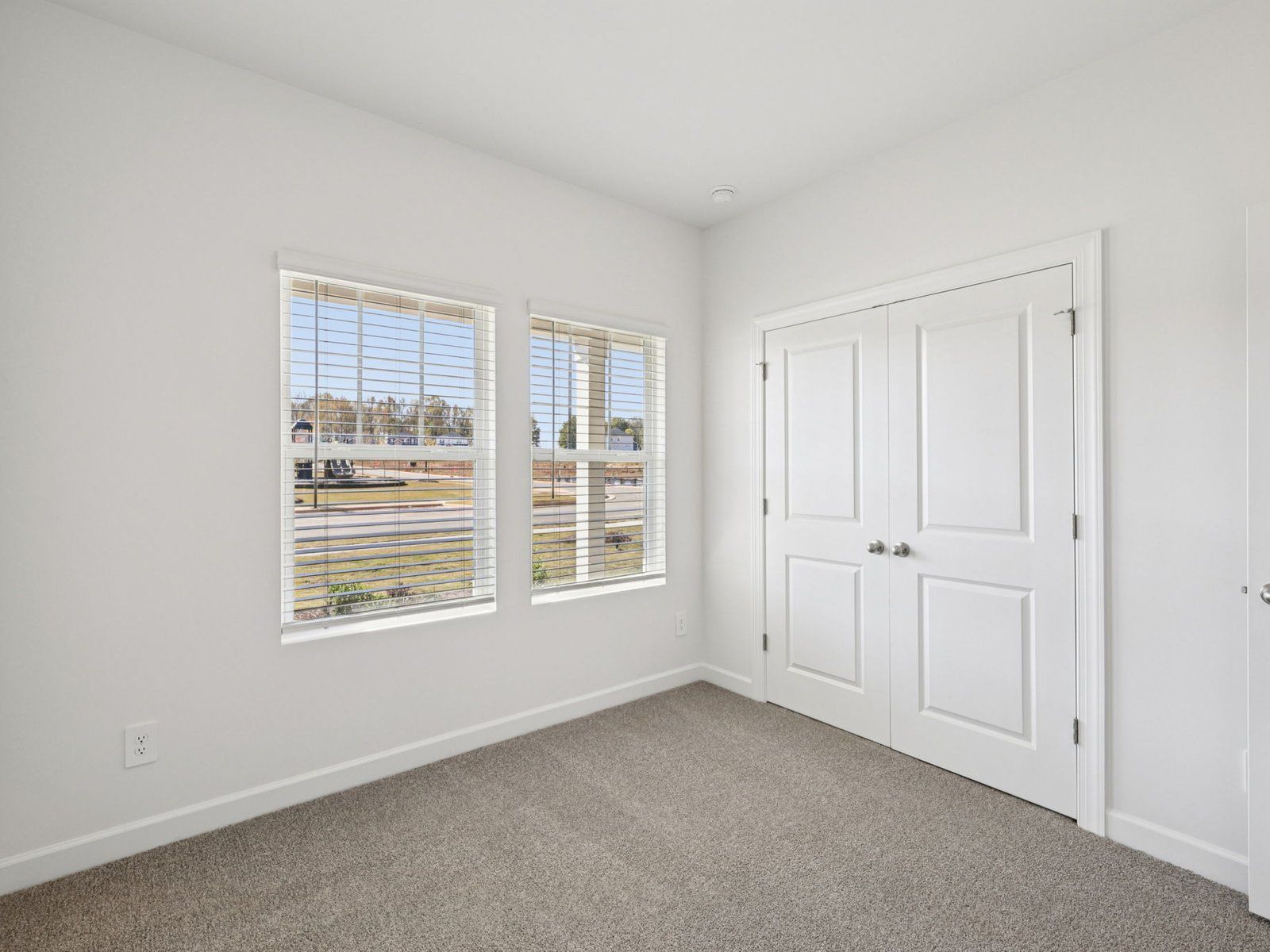 The Carolina Side Load floorplan offers three secondary bedrooms.