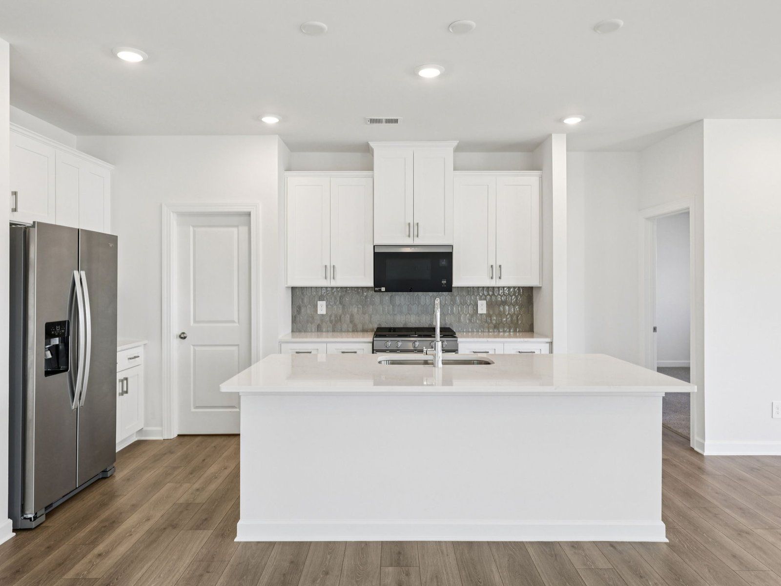 Cook your favorite meals in the sleek, modern kitchen.