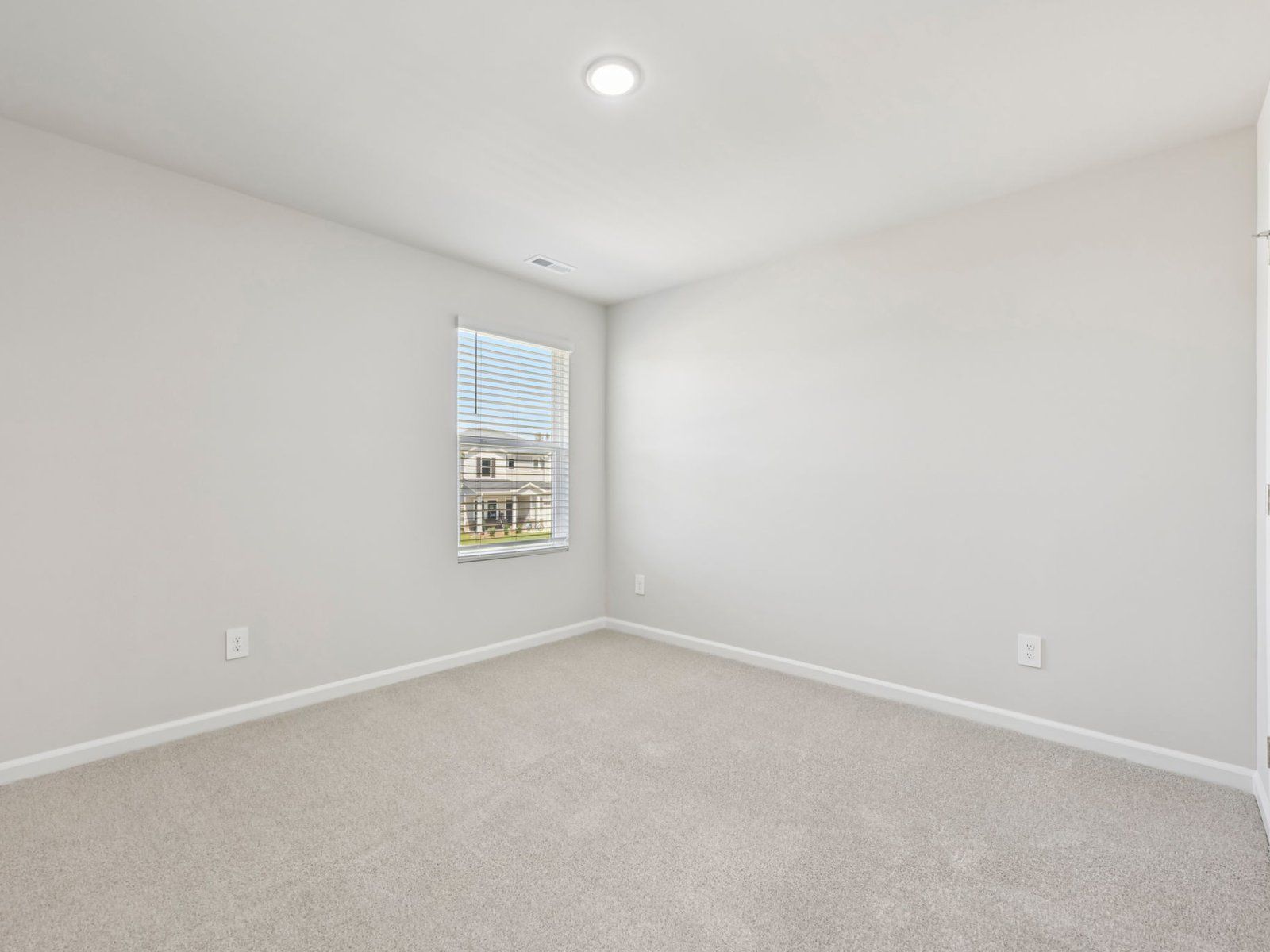 Secondary bedroom in the Chatham floorplan at a Meritage Homes community in Garner, NC.
